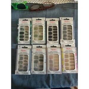 Eight sets of Sally Hansen nail strips.